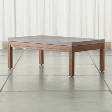 Modern, industrial and chic, our pomona coffee table has an expansive concrete top and solid plank legs, giving it enduring style that withstands the elements. Parsons Concrete Top Elm Base 48x28 Small Rectangular Coffee Table Crate And Barrel Uae