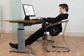 Sometimes it will be caused by wear and tear on your swivel chair where one part may have worn out more than another. Businessman Leaning Back In His Chair While Working On Computer In Modern Office Stock Photo Picture And Royalty Free Image Image 44714238