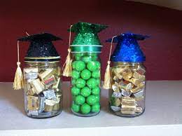 Graduation Gifts Mason Jars Filled With Candy The Hat Is A Balloon Weight With A Tassel School Colors Can Balloon Weights Graduation Party Graduation Gifts
