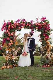 Have your florist create a ceremony wall of leafy greens and. Bel Air Wedding With A Tropical Ombre Floral Arch Ruffled