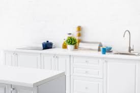 Maybe you would like to learn more about one of these? Selective Focus Of Modern White Kitchen Interior With Kitchenware Near Brick Wall Free Stock Photo And Image