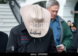 In this Wednesday, Jan. 29, 2020 photo, Al Rehder, left, talks with Larry  Koland in Rehder's car condo at the Eagan Car Club in Eagan, Minn. Behind  Rehder's 1939 Ford is a