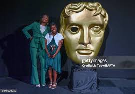 George Webster and guests pose with the Presenter award during the... News  Photo