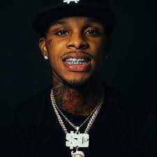 Rapper Toosii is under fire because of offering to fly 15 year old girl out  that got snatched by her wig even though she tried to pay but the stylist  didn't accept