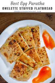 Egg Paratha Anda Paratha Is Omelette Stuffed In A Layered Flat Bread It Is A Traditional Indian Breakfast That Egg Paratha Low Carb Recipes Dessert Paratha