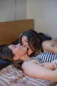 Affectionate young lesbian couple - Stock Photo - Dissolve