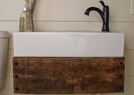 I was contacted by a reader who really liked the custom vanity designed for the rebel house but the reader asked that the vanity be longer, with more drawers. Remodelaholic Reclaimed Wood Floating Vanity
