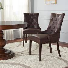 An accent chair accentuates the room. Home Decorators Collection Bardell Upholstered Tufted Dining Chair With Brown Faux Leather Seat And Nailheads Set Of 2 22 In W X 38 In H 3186 D Chair W The Home Depot