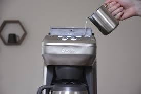 Unlock the upper burr and remove it. Breville The Grind Control Review Fresh Custom Coffee