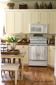 Faded Charm Tulips In The Kitchen Above Kitchen Cabinets Kitchen Cabinets Decor Home Kitchens