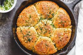 Put the heated cauliflower rice into a mixing bowl, and combine with the mozzarella cheese, italian seasoning, garlic powder. Garlic Butter Keto Bread