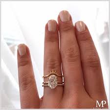 A Perfect Pair Showing Our De Solitaire Set In Yellow Gold With A 2 10 Carat Ova Nyc Engagement Rings Wedding Rings Solitaire Unique Diamond Engagement Rings