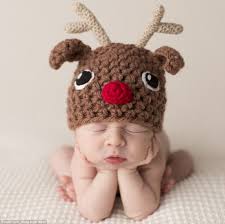 I posted some christmas baby outfits a few weeks ago and realized that not everyone wants to dress their baby up in a cute outfit. Photographer Sandi Ford S Festive Photo Shoot See Babies Wearing Santa Hats Daily Mail Online