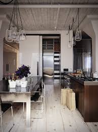 This is labeled as an industrial #kitchen but note the rangehood which has been tiled. Tips For An Industrial Style Kitchen Queen City Kitchen Bath