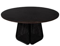 In smaller homes, use a small modern dining table as a kitchen table instead. Modern Round Dining Table With Black Cane Pedestal Carrocel Fine Furniture