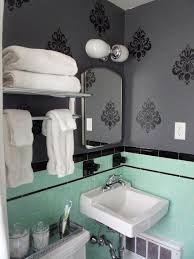 Black may not be the first color that comes to mind when you're looking for bathroom decor ideas. 8 Ways To Spruce Up An Older Bathroom Without Remodeling Gray Bathroom Decor Yellow Bathroom Tiles Black Tile Bathrooms