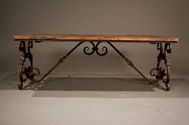 The pio coffee table base elevates the table top above an elegant iron bottom with crossing supports and scroll work along the sides. Coctail Table Iron Legs Ornate Wrought Iron Wood Coffee Table Image 2 Metal Of Life Wrought Iron Table Legs Wrought Iron Dining Table Iron Coffee Table