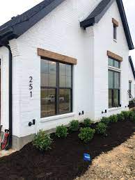 Modern farmhouse exterior paint colors 2020 cedar. The Broadmoor House Exterior Modern Farmhouse In 2020 Brick Exterior House Black House Exterior Painted Brick House