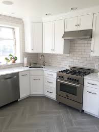 Subway tile with gray or off white grout can make a dramatic look. Gray White Kitchen With Subway Tile Backsplash In Fireclay Tile