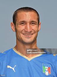 Italy's defender Giorgio Chiellini poses