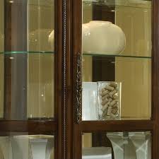 The handsome elegance of the pulaski 20205 corner curio cabinet transforms any corner of your home into a beautiful showcase for your treasured items. Pulaski Foxcroft Curved End Curio Cabinet 102003