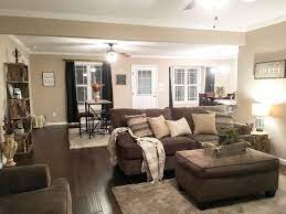 Neutral browns can coexist with a variety of complementary hues to. Farmhouse Living Room Open Floor Plan Neutral Colors Dark Hardwood Flo Dark Brown Couch Living Room Dark Hardwood Floors Living Room Dark Floor Living Room