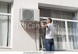 These components of the air conditioner work to move air in and out of your home. Installation Of Air Conditioner Worker Installs The Outdoor Unit Of The Air Conditioner Canstock