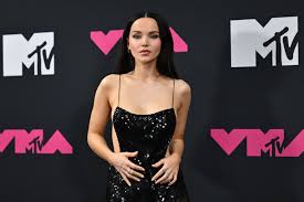 Dove Cameron flashes side boob in glittering black gown at the VMAs 2023