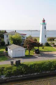 In the late 1700s, before the old point comfort lighthouse was built, a soldier was stationed there to keep a lantern burning at night, to warn passing ships of the small but treacherous point of land. Old Point Comfort Light Wikipedia