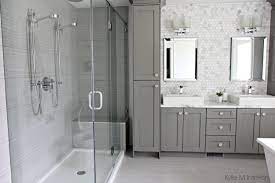 This is an example of a small contemporary bathroom in melbourne with an alcove shower a one piece toilet white tile ceramic tile white walls mosaic tile. Sophisticated Gray And White Bathroom Design Pelham And White