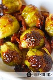 Brussels sprouts are roasted with bacon and maple syrup for a smokey, caramelised side dish. Brussels Sprouts With Bacon And Maple Syrup Is The Perfect Brussels Sprouts Side Dish Maple Bacon Brussel Sprouts Sprout Recipes Frozen Brussel Sprouts Recipe