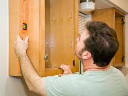 If you start from the high point though, even if the floor it's not leveled … the top of your cabinets will be leveled, and you will only have to play with the kitchen cabinets legs in order to adjust the desired height. Diy Kitchen Cabinets Pictures Options Tips Ideas Hgtv