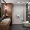 Slate blue powder room walls complement a marble and brass washstand fixed against an oak herringbone pattern floor and beneath a capiz mirror lit by brass sconces with white shades. Https Encrypted Tbn0 Gstatic Com Images Q Tbn And9gcrf93 Uzsskcxwmpp Vg1vimko4xgc7jopsqay9kr6qo0aqqx44 Usqp Cau