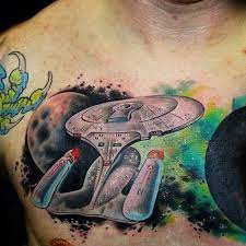 The symbol from the television show was simple, and this young woman wanted that simple design to be on her the location of this star trek insignia from the television show is pretty plain, but that does not matter at all because the tattoo is still pretty amazing. Prepare To Geek Out Over These Tattoo Ideas Star Trek Tattoo Tattoos Galaxy Tattoo