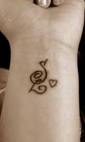 Usually, people love to have a small heart tattoo as a sign of love for their beloved, family member and friends. V And S Letter Tattoo Designs