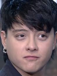 The Pucture of Daniel in Front of A Christmas Tree