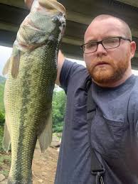 Large bass caught in shallow creek