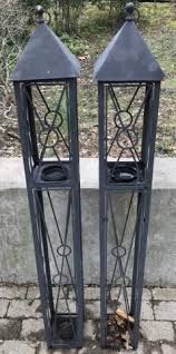 Some lanterns have a rustic wood motif, while others are made from metal such as brushed nickel suspended candle lanterns provide a soft flicker of light for outdoor patio areas and indoor living rooms or bedrooms. Lot Art Pair Outdoor Patio Hanging Pillar Candle Lanterns