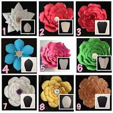 A sweet and colorful bouquet of flowers with a tracing of your child's hand is sure to be cherished. Paper Flower Paper Flowers Craft Big Paper Flowers Paper Flowers Diy