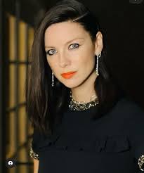 An incredibly elegant black dress worn...