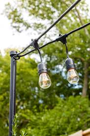 It s a time for yard celebrations, household outings, as well as great deals of wonderful hammock lounging. How To Install Poles To Hang Outdoor String Lights In Your Backyard Better Homes Gardens