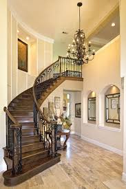 Traditional Staircase With Crown Molding Hardwood Floors High Ceiling Chandelier Staircase Design Traditional Staircase House Design