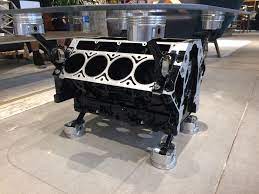 The mounted pistons are leveled/welded to ensure the glass tabletop sits flat. Ls1 Engine Block Coffee Table In Black And Silver Send A Message For Purchasing Details Automotive Furniture Engine Block Table Engine Table