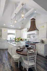 The ideal distance between ceiling vent and stovetop varies, but for optimal. Vaulted Ceiling Kitchen Rockville Centre 1404 Farmhouse Kitchen New York By Aladdin Remodelers Houzz
