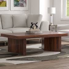 The classic look of oak wood can add a natural touch to any room in your house, but an oak coffee table can be a statement piece. Theron Solid Wood Coffee Table Natural Finish Decornation