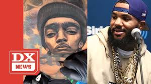 The new ink spelled out prolific, which is the same word that nipsey hussle had a tattoo of on the side of his face. The Game Gets Massive Nipsey Hussle Chest Tattoo Youtube