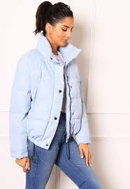 Pin By One Nation Clothing On Outfit Inspiration Blue Puffer Jacket Baby Blue Colour Outfit Inspirations