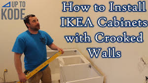It's best to install upper cabinets before the base cabinets go in. Ikea Upper Cabinet Install How To Install Cabinets With Crooked Walls Youtube
