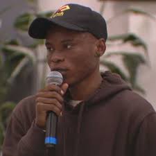 Asylum-seekers rally for housing at vacant King County hotel amid ongoing  shelter crisis