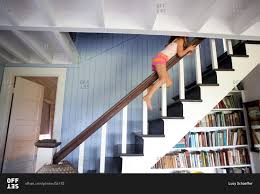 Turning around, he saw trudeau sliding down the railing. Young Girl Sliding Down Railing Stock Photo Offset